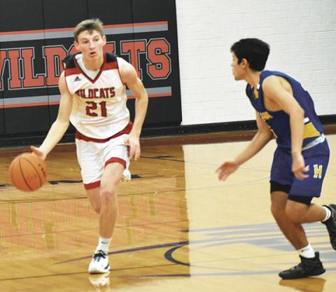 Justin Fitzgerald/sports@cherokeescout.com Andrews’ Ty Clark dribbles the ball up court during the Wildcats’ 62-44 win over Highlands on Saturday.
