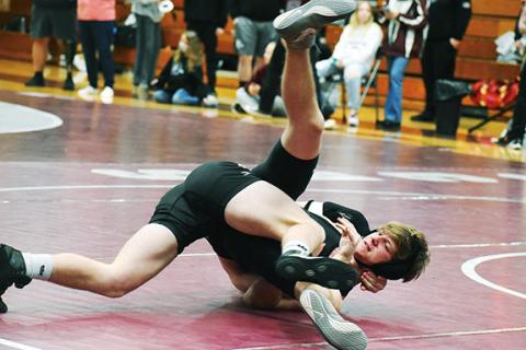 Justin Fitzgerald/sports@cherokeescout.com Murphy’s Sam Kessler tries to get out of Robbinsville’s Logan Hyde’s grip during the Smoky Mountain Conference Wrestling Championships on Saturday.