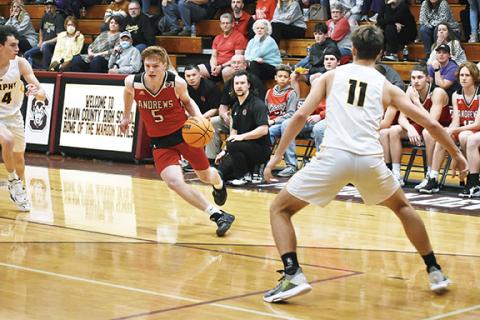 Justin Fitzgerald/sports@cherokeescout.com Andrews’ Donovan Bateman looks for an open teammate during the Wildcats’ 74-67 win over Murphy on Thursday.