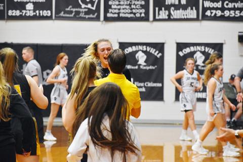 Justin Fitzgerald/sports@cherokeescout.com Murphy senior Torin Rogers celebrates with assistant coach Cody Webb after the horn sounds Feb. 1.