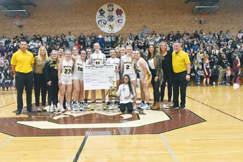 Justin Fitzgerald/sports@cherokeescout.com Murphy girls basketball players and coaches celebrate after beating Robbinsville 56-49 for their fifth straight Big Smoky Mountain Conference Tournament title Friday.