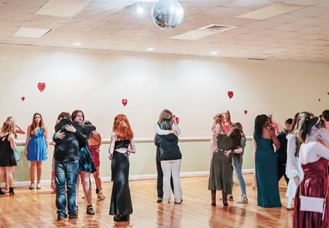 Alex Wilson/For the Cherokee Scout Several groups joined the Valentine’s Dance under a disco ball Saturday in Andrews.