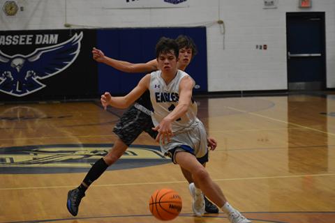  Justin Fitzgerald/sports@cherokeescout.com Hiwassee Dam’s Preston Hyde gets around Robbinsville’s Brock Adams during the Eagles’ 63-51 loss to the Knights on Feb. 9.