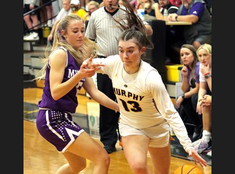 Murphy's Addie Johnson tries to get by Mitchell's Chandra Jenkins during the Lady Bulldogs' 64-47 win over the Lady Mountaineers on Thursday. Johnson scored a career-high 18 points in the win.