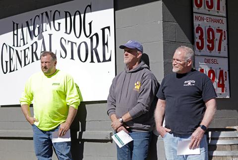 Jared Putnam/editor@cherokeescout.com Steven Graves of Graves Directional Drilling and Hanging Dog General Store owners Tim and Stephen Lescalleet stand beside the building during the ribbon-cutting ceremony bringing high-speed internet to the area on March 1.