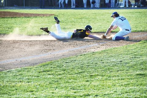 Justin Fitzgerald/sports@cherokeescout.com Murphy’s John Ledford is tagged out by Smoky Mountain’s Zeb Fisher during the Bulldogs’ 9-3 win over the Mustangs on Friday afternoon.