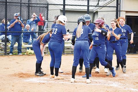April McNabb/Contributing Photographer Hiwassee Dam celebrates Payton McNabb’s home run during the Lady Eagles’ 11-4 win over Cherokee on March 15.