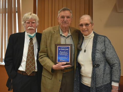 Bill Belian/Contributing Photographer  Dr. Brian Mitchell (left) presents local pastor Chester Jones with an award of appreciation. His wife, Linda Jones, stands beside him.