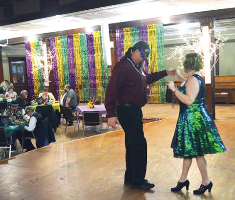 Photos by Abigail Hickman/Staff Correspondent Dee Henson breaks in the dance floor with her boyfriend, Dustin Demos.