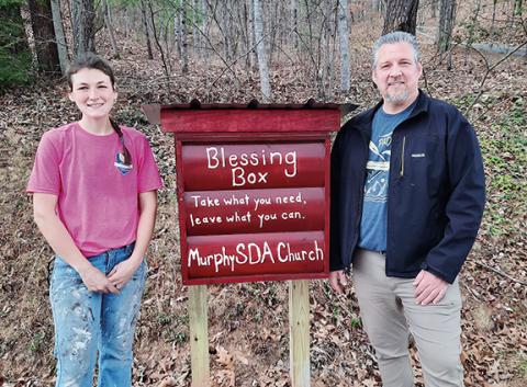 Photos by Bill Belian/Contributing Photographer  Julian Stephens (left) and pastor Craig Fish at the newly built Blessing Box at the Seventh-day Adventist Church.