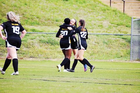 Justin Fitzgerald/sports@cherokeescout.com Murphy’s Lailee Holloway (center) celebrates with Emonie Watson (left) and Ashlyn Stroupe (right) after Watson’s goal against Smoky Mountain. It would be the only goal of the match Thursday.