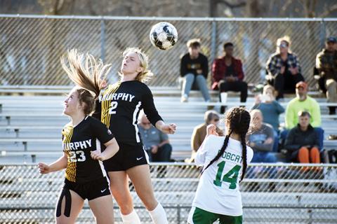 Justin Fitzgerald/sports@cherokeescout.com Murphy’s Emma Ledford (23) and Lochlan Rogers (2) both try to head the ball during the Lady Bulldogs’ 3-1 win over Blue Ridge on Thursday.