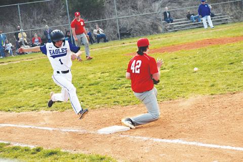 Justin Fitzgerald/sports@cherokeescout.com Hiwassee Dam’s Kyle Taylor tries to beat out a ground ball during the Eagles’ 17-2 win over Copper Basin on March 29.