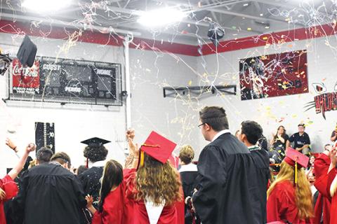 Justin Fitzgerald/sports@cherokeescout.com Seniors in Andrews High School’s Class of 2022 celebrate after receiving their diplomas Thursday evening in the school gym, where it was moved due to rainy weather. 