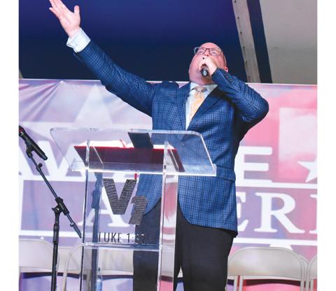 Bill Belian/ Contributing Photographer  Evangelist D.R. Harrison prays under the tent for God’s healing power to touch others as it has him.