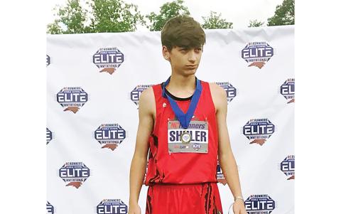 Angie Shuler/ Contributing Photographer Andrews eighth-grader Logan Shuler took first in the high jump at the NCRunners Middle School Elite Invitational 2022 on May 6. His jump of 5 feet, 9 inches, was a new school record in the event.