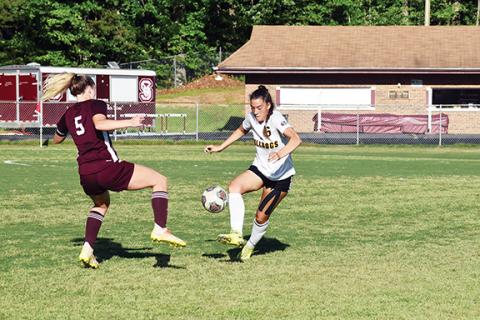 Justin Fitzgerald/sports@cherokeescout.com Murphy junior Cat Barreiro tries to dribble around Swain County’s Mazie Helpman during the Lady Bulldogs’ 4-0 loss to the Lady Devils on May 16.