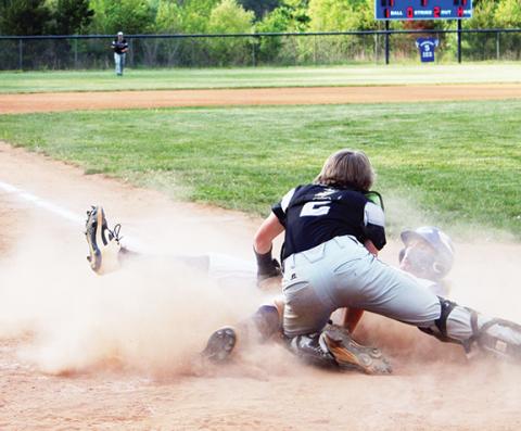 Heidi Hooper/Contributing Photographer Hiwassee Dam’s Seth Hooper slides into home with the winning run for the Eagles against Robbinsville on May 2.