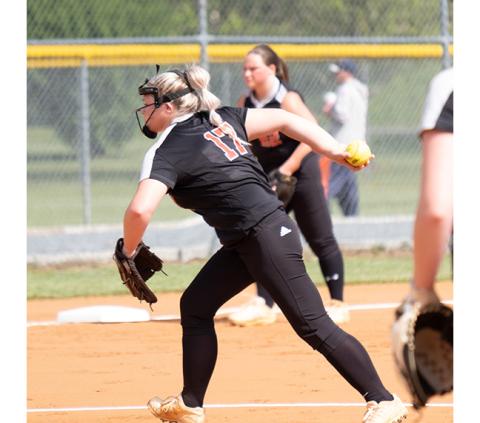 Sam Jokich/Contributing Photographer Andrews pitcher Summer Garrett steps to the plate during the Lady Wildcats’ 14-4 loss to Robbinsville on April 29.