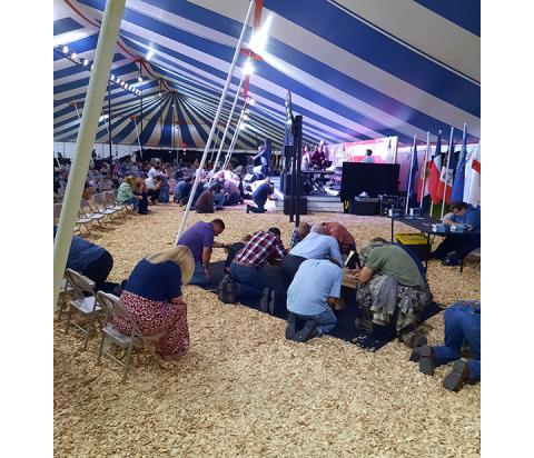 Bill Belian/Contributing Photographer  Folks come forward to pray under The Big Gospel Tent a few weeks ago.