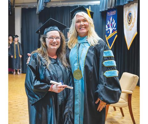 Dr. Donna Tipton-Rogers, president of Tri-County Community College, poses with Ellen Woods during the college’s annual commencement ceremony on May 6 at the main campus in Peachtree.