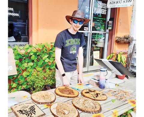 Photos by Anngee Quinones-Belian/Staff Correspondent Keskel Yatrofsky was offering wood burnt products from Wood Art From Your Heart during the First Friday Art Walk.