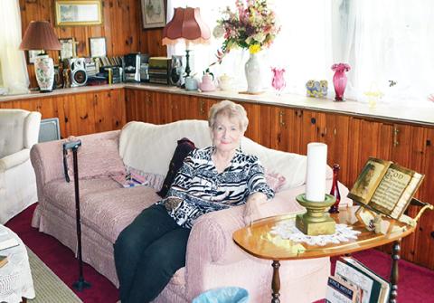 Abigail Hickman/Staff Correspondent Joy Lynn of Murphy sits in her sunny parlor ready to serve food to anyone who is hungry.