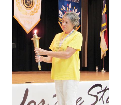 Photos by Terence Fairies/Contributing Photographer Patty Singer was this year’s torch bearer as well as the Senior Games Spirit Award winner.
