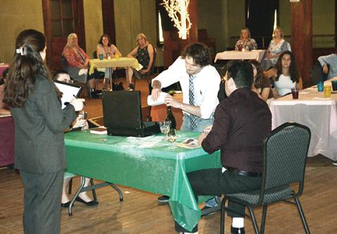 Photos by Abigail Hickman/Staff Correspondent Blake Williams (middle with white shirt) searches for clues of the killer in a memorable performance as Dr. Tony Bullfinger.