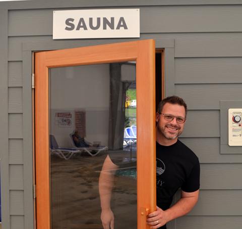 Abigail Hickman/Staff Correspondent Rodney Morris, owner of Murphy Health & Fitness, pops his head out of the center’s new sauna.