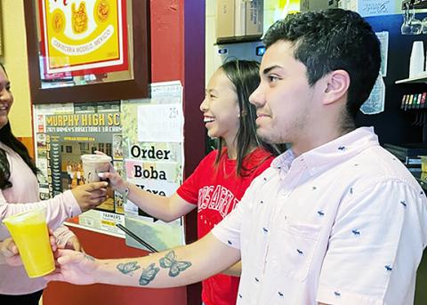 LoriBeth Stalcup and Jace Godinez serve their new Boba King teas to customers at El Manzanillo Mexican Restaurant in Murphy.