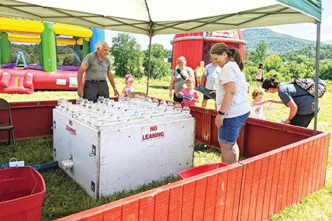There were carnival games, bounce houses and even a portable pool for children to enjoy during the Peachtree Community Center’s free Summer Kick-off on June 18. Volunteers helped make the event a success, and not just in the dunking booth.