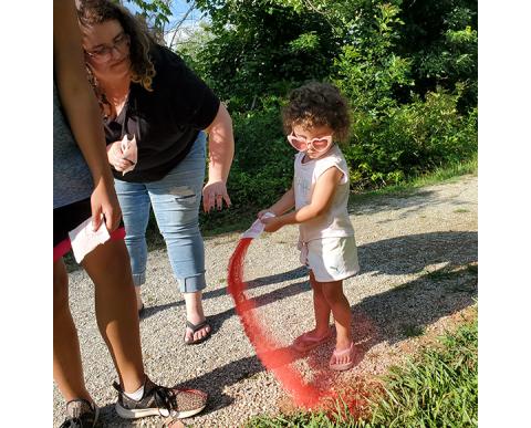 Photos by Matthew Crawford/Cherokee Scout To create awareness on the World Day Against Human Trafficking, a local Red Sand Project event was held at 6 p.m. June 30 at Konehete Veterans Park. Local residents and staff members of Reach of Cherokee County Inc. were on hand along with others. The Red Sand Project uses sidewalk interventions and earthwork installations to create opportunities for people to “question, connect and take action against vulnerabilities that can lead to human trafficking and exploitat