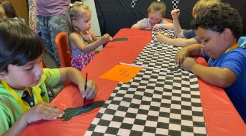 Children ages 3-12 were “Running the Race” during vacation Bible school at Murphy Seventh-day Adventist Church from June 26-29. Checkered flags, trophies and race cars set the stage for learning biblical principles, making crafts and having fun. The drive-up of two real race cars offered driver-seat testing and a finish-line victory.