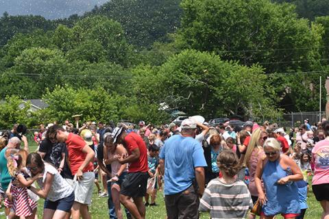Spectators flocked to the baseball field for the peanut drop, a long-standing tradition at Andrews Recreation Park.