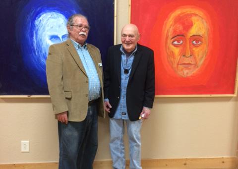 New Cherokee Scout columnist David Vowell stands with David Rabhan in front of Rabhan’s two large self-portraits