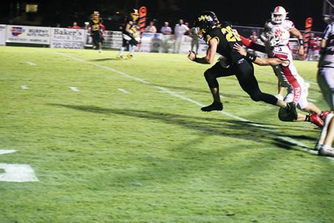 Murphy’s Hunter Stalcup breaks a tackle during his 16-yard touchdown catch and run during the Bulldogs’ 24-7 loss to Franklin on Friday.