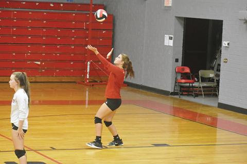 Justin Fitzgerald/sports@cherokeescout.com Andrews Kinleigh Queen gets her serve up during the Lady Wildcats’ 3-0 win over Nantahala on Thursday.