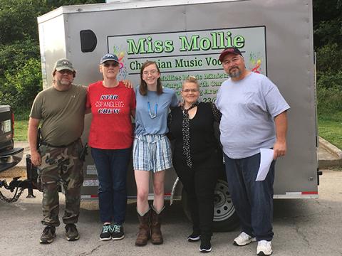 David Hull, Cynthia Hull, Mollie Hull (from left), all of Miss Mollie’s Music Ministry in Murphy, and Bruce and Lissie Welch (from right) of One Voice Second Chance Ministry in Niota, Tenn., team up to transport needed supplies to families in Kentucky.
