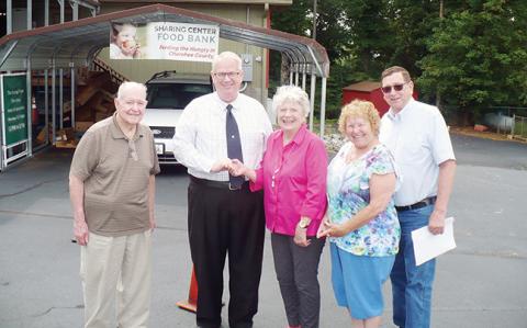 Last week, the keys to a warehouse building at First Baptist Church in Murphy were handed over to the Sharing Center to be its new home. Shown are (from left) are Ray Herrington and pastor Jimmy Tanner of the Baptist church; and Sande Kimball, Judy Standish and Steve Heinchon of the Sharing Center.