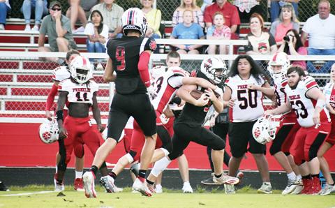 Andrews’ Austin Martin tries to evade a Franklin defender during the Wildcats’ scrimmage against the Panthers on Friday night.