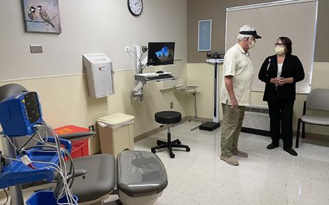 Program Director Gina Sneed speaks with Corey Bailey during a ribbon-cutting ceremony for the Erlanger Western Carolina Hospital Wound Care Center on June 21.