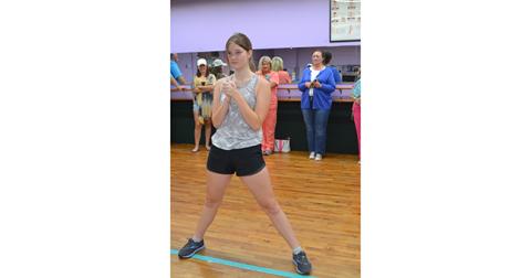 Camryn McMillan, 14, of Unaka, practices her moves while parents look on during the Murphy School of Dance’s Cheer Camp on Aug. 4.