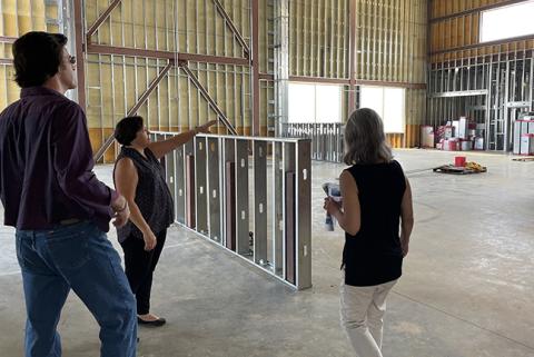 Cherokee Scout Publisher David Brown (left) chats with Alissa Cheek and Marie Monies (right) during a tour of the new Schools of Innovation & Technology in Peachtree on Friday morning.