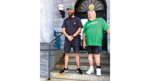 Bail agent Doobie White and his son, Brody White, feel right at home outside the Cherokee County Courthouse in downtown Murphy.