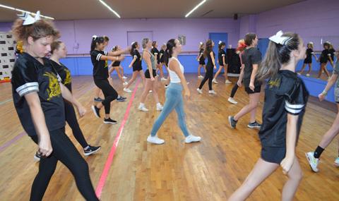 Madelynn Cribbs, 16 (far left), shows off her dance moves at the special event, which included instruction from a former NFL cheerleader who is also from Murphy.