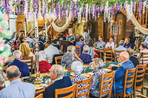 Sam Jokich/Staff Correspondent There was a full house on hand during “An Evening in Paris,” the annual Big Brothers Big Sisters Gala on Sept. 3 at the colorfully decorated McGuire’s Millrace Farm.