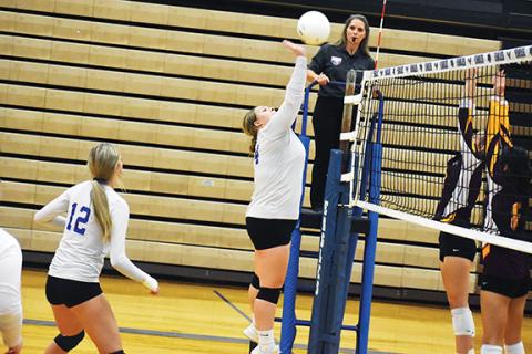 Justin Fitzgerald/sports@cherokeescout.com Hiwassee Dam’s Allison Stiles tries to get the ball over the net during the Lady Eagles ‘straight-set loss to Cherokee on Thursday.