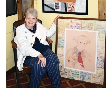 Anngee Quinones-Belian/Staff Correspondent  Betsy Henn Bailey’s love for her father, P.J. Henn, prompted her to paint a portrait of him, which she gifted to the iconic Henn Theatre in downtown Murphy.