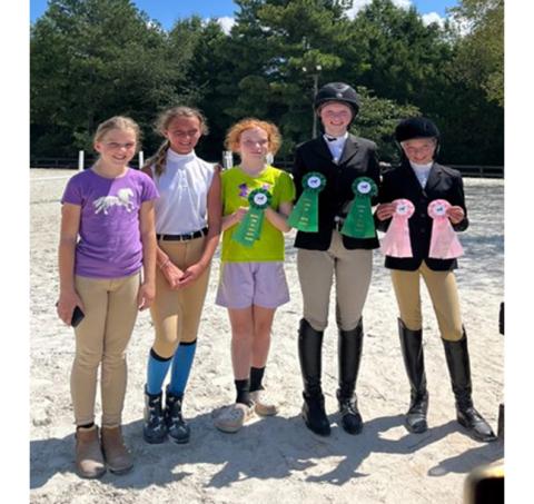 Kathryn Moses/Contributing Photographer Riders from In the Irons Equestrian Academy in Franklin participated in their first IEA competition at Cedar Hill Farms in Waxhaw on Aug. 27. The team travels throughout the state for competitions. Members are Elianna Meiners, Lucia Smithdeal, Annalise Wike, Emily Moses and Charlie Merritt.